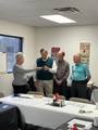 Bruce Janes receiving his Rotary Pin.